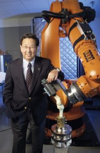 Dr. Savio Woo with a robotic/Universal-Force Sensor testing system. – University of Pittsburgh